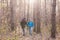 People, hike, tourism and nature concept - Couple tourist hiking in autumn forest