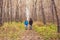 People, hike, tourism and nature concept - Couple tourist hiking in autumn forest