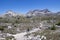 People hiking along footpath around the Three Peaks during day, South Tyrol Italy