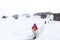 People hiking on snow trail towards base camp