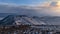 People hiking to recently erupted volcano at Fagradalsfjall in Geldingadalir valleys with view over the snow-covered mountains.