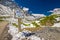 People hiking on the top of Albula pass in Swiss Alps