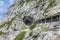 People at hiking trail through Austrian mountains to ice cave