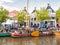 People and historic boats in old harbour during event Admiralty Days, Dokkum, Friesland, Netherlands