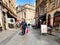 people on historic Lille street with shops