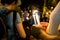 People holding candle vigil in darkness seeking hope, worship, p