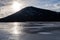 People ice skating on the frozen Vermilion lakes