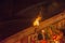 People from India performing ceremony in Varanasi, with fire on the banks of the Gages River