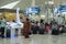People at information stand in Airport waiting lounge