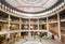 People inside a multilevel shopping mall in Gallery Ravenstein, example of monumental modernism in architecture