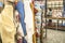 people inside of traditional fabric store with stacks of colorful textiles