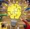 People with Jigsaw Puzzle Forming Light Bulb
