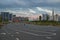 People jogging on the wide avenue in a big city. Skyscrapers on the background.