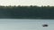 People on a kayak swim on the lake