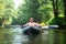 People in kayak swim on river. Kayaking