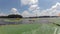 People kayaking on lake with lily pads