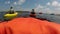 People kayaking on lake with sunshine wearing life vest