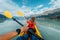 People kayaking paddling in kayak amazing nature landscape in Squamish Howe Sound a fjord surrounded by mountains