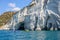 People with kayaks exploring the caves, Melos, Greece