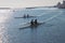 People on kayaks in pairs in the sea at sunrise in Italy