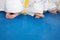 People in kimono sitting on tatami on martial arts