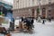 People kindle the fire in barrels on the frosty winter street in front of the city administration during anti-government protest