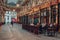 People at the Lamb Tavern pub tables inside Leadenhall Market arcade, London, UK