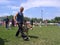 People lead dogs at the dog show in the ring in Iskitim Russia 2011 owners show the best breeds of Central Asian shepherd