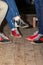 People legs with bowling shoes standing on old wooden floor