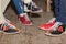 People legs with bowling shoes standing on old wooden floor