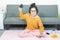 People and leisure concept -Angry asian young woman with gamepad playing video games on console and lose, resting on weekends with