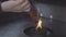 People light incense stick with yellow flame for pray for luck, hope, and fortune in buddha temple Hong Kong, China, famous