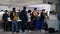 People line up to pay cashier at Shanghai Pudong airport duty free