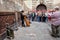 People Listen to Busker Playing Harp in Barcelona