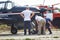 People look at the light sports aircraft standing on the airfield