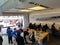 People look at products and talk to sales reps inside Apple Store