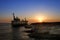 People look at a stranded ship