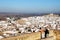 People looking across the town rooftops, Antequera, Spain.