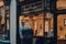 People looking at retail display of David Duggan shop in Burlington Arcade, London, UK