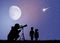 People looks at the moon in the telescope