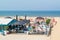 People on lounge terrace of waterfront beach club in Scheveningen, The Hague, Netherlands