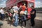 People making donations to a charity collection bucket to ride on a classic bus