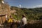 People in masks on ancient streets of town of Calcata Vecchia in Italy. Second wave of coronavirus covid19, keeping social dist