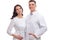 People in Medicine. Portrait of Two Positive Caucasian Doctors in White Smocks Posing Together Embraced Against White