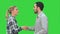 People meet and shake hands on a Green Screen, Chroma Key.