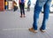 People men and women in a line / queue at the supermarket / mall  at a social distance during the quarantine / epidemic