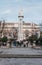 People by the monument on Plaza del Triunfo, Seville, Spain