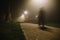 People motion blur in the park, night and heavy fog