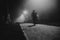 People motion blur in the park, night and heavy fog