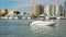 People on a motor boat sailing across the Sarasota marina bay